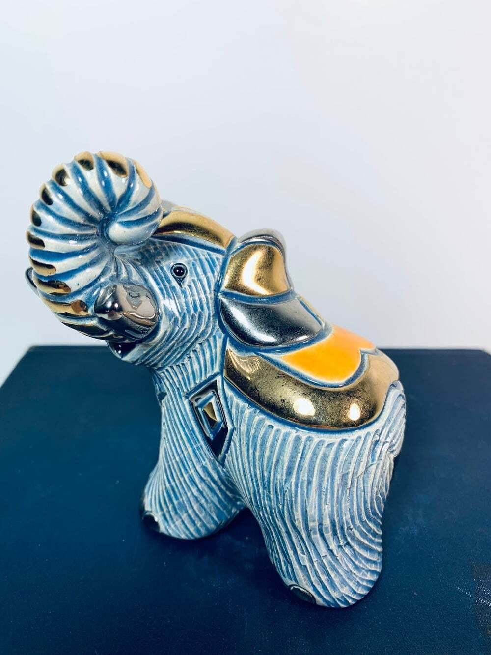 Elephant blue and gold figurine